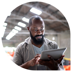 Warehouse employee reviewing logs